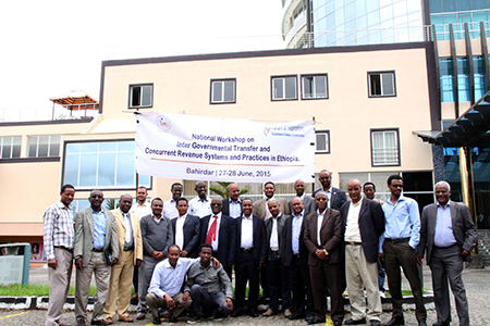Members of a workshop posing in front of a building in Ethiopia