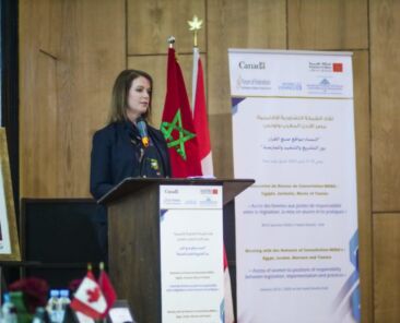 Woman giving speech at podium in Morocco