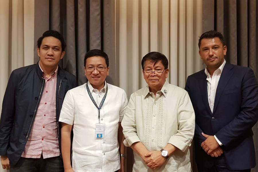 Four men posing for photo at Philippines federalism conference